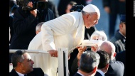 Pope Francis blows out candles as he celebrated his 78th birthday at the Vatican on Wednesday, December 17.